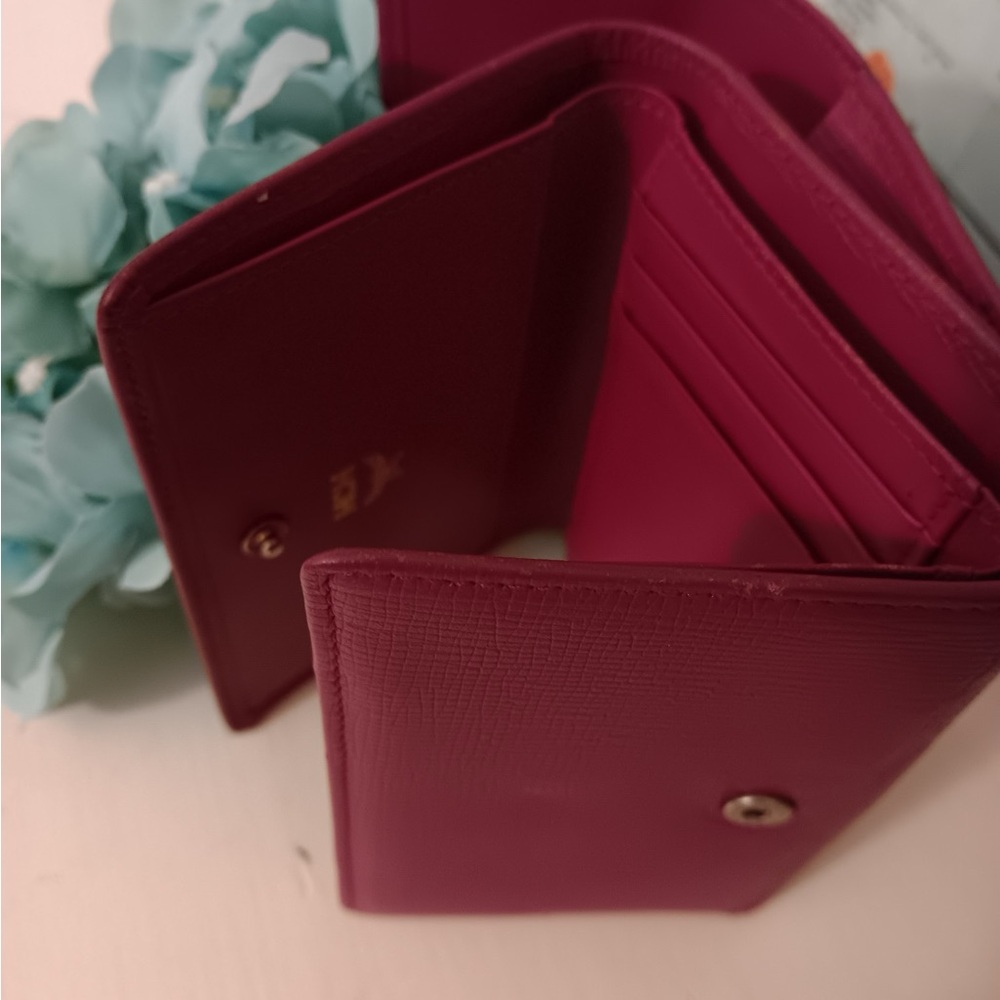 MCM trifold wallet with gold hardware and MCM AUTHENTIC charm - Picture 6 of 8